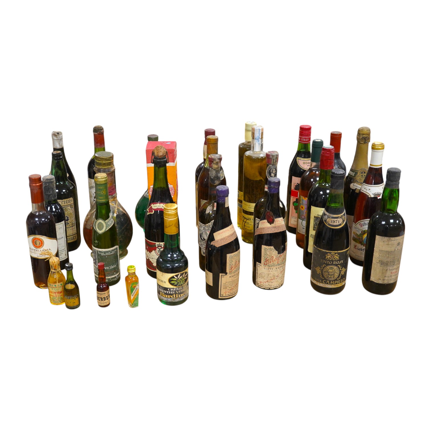 Twenty bottles of spirits, liqueurs and wine, together with some half bottles and miniatures, including; a 1947 Heidsieck & Co. Dry Monopole champagne, a 1983 Chateau Ferrande Bordeaux, two bottles of Herbes Mesclades, a